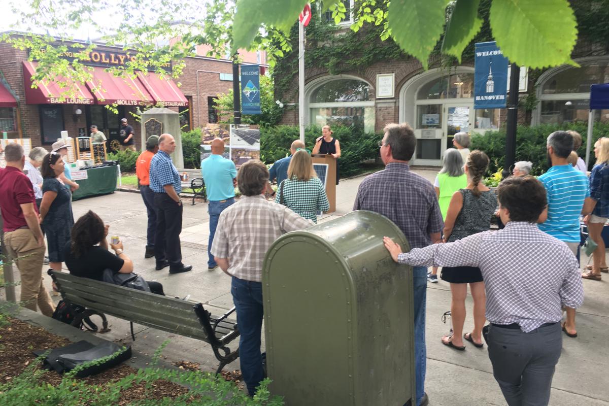 Woman at Podium with Audience 2